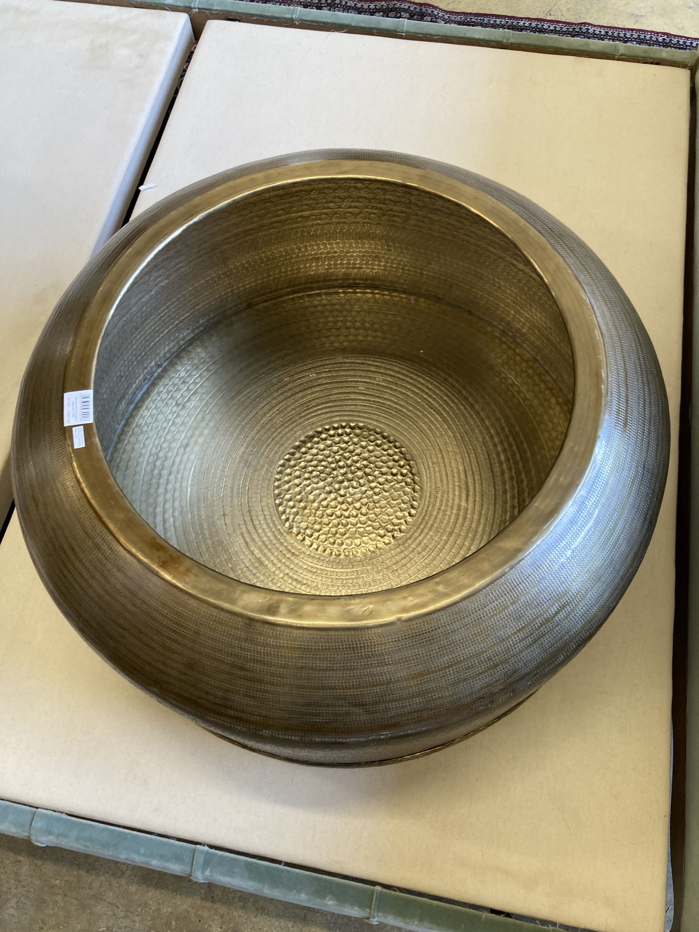 A contemporary Indian brass drum coffee table, 79cm diameter